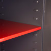Internal red shelf inside phoenix planet hs6073 security safe showing adjustable shelf slots