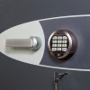 Close up of the electronic lock and handle on the phoenix cosmos hs9071 security safe showing keypad and keyhole