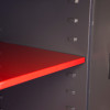 Red internal shelf inside the phoenix cosmos hs9071 security safe showing adjustable shelf supports