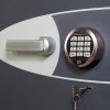 Close up of electronic lock keypad on phoenix cosmos hs9072 security safe showing handle and key slot