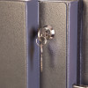 phoenix cosmos hs9073 security safe showing a close-up of the internal key lock with a key inserted