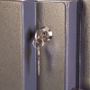 phoenix cosmos hs9074 security safe showing a close-up of the internal key lock with a key inserted