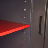 Red internal shelf inside the phoenix cosmos hs9074 security safe showing support brackets and side wall details