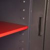 Interior view of the phoenix cosmos hs9074 security safe showing the red adjustable internal shelf