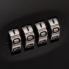Close up of the lock mechanism on the phoenix key store code showing four numbered dials on a black background