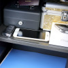 phoenix vela security safe electronic lock with phone, keys, passport and a small metallic case inside
