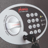 phoenix vela security electronic lock showing front close up of keypad and lock handle with key inserted