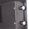 Close-up of locking bolts on a phoenix vela security electronic lock showing metal bolt ends and textured metal surface