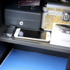 phoenix vela security electronic lock on a black box containing valuables including a phone passport and car key