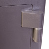 Close-up of the hinge on the phoenix cash deposit security electronic lock showing its textured grey surface