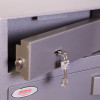 phoenix cash deposit security electronic lock showing a close-up of the lockable deposit slot with key inserted