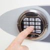 phoenix fortress 1182 security safe electronic lock keypad being pressed by a finger