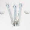 Three floor fixing bolts for the phoenix fortress 1184 security safe electronic lock on a white surface