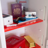 Contents inside a phoenix fortress 1184 security safe electronic lock including passport, camera, keys, pen and gold bar