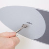 Hand inserting key into the lock of the phoenix fortress 1185 security safe key lock
