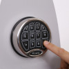 Keypad in use for Phoenix Firefox fireproof safe electronic lock with a finger pressing a number