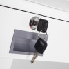 phoenix firefox fireproof safe key lock with two black keys inserted in the lock and a grey handle on a white drawer