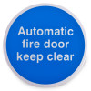 Round blue automatic fire door keep clear metal sign with self adhesive backing shown from the front