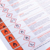 Close up of a coshh regulations poster showing hazard symbols and safety information in red text and icons