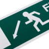 Close up of a fire exit sign EEC directive down left with a running figure and arrow on rigid plastic background