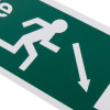 Close up of fire exit sign eec directive down right with running figure and white arrow on green rigid plastic background