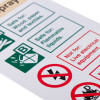 Close up of white rigid plastic foam extinguisher ID sign showing safety and warning symbols in green and red text