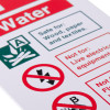 Close up of a water id sign printed on white rigid plastic showing safety and hazard icons and text