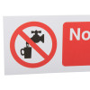 Close up detail of mandatory bathroom hygiene not drinking water sign showing a tap and cup with a red prohibition symbol