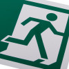 Close up of a white rigid plastic self adhesive fire exit sign showing a green running figure on white background