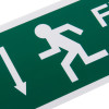 Close up of a fire exit sign eec directive self adhesive down showing running figure and downward arrow on green background