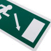 Close up of fire exit sign eec directive self adhesive showing figure and arrow pointing down right on green background