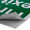 fire exit sign eec directive self adhesive right partially peeled from corner showing adhesive side
