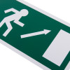 Close up of fire exit sign eec directive self adhesive up right showing running figure and arrow on green background