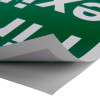 fire exit sign eec directive self adhesive up right showing the edge peeled back from the surface