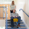 evacuation chair being used down a flight of stairs