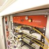 Close up of redetec rack mount fire supression unit installed in a server rack with cables connected