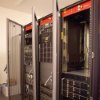 Redetec rack mount fire supression unit installed inside open server racks with visible wiring and hardware components