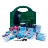 bs8599 1 catering first aid kit medium showing the green box with medical supplies and a first aid guide arranged in front