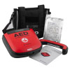 A red defibrillator with a a black carry case and a set of defibrillator pads