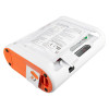 AED interior showing sealed Mediana electrode pads, printed placement diagrams, and pull‑tab for pad removal.