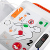 Instruction panel showing adult pad placement diagrams, numbered steps, and icons for shock and child mode.