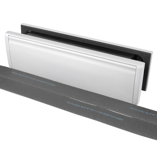 Image showing the Rutland Letterplate with silver finish and 30 minute intumescent strips laid out in front