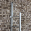 Saffold Fold Out Fire Escape Ladder in open position mounted against a brick wall showing metal frame and rungs