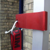 Close-up of the red metal hook and strap attachment on the Saffold Fold Out Fire Escape Ladder Safety Harness