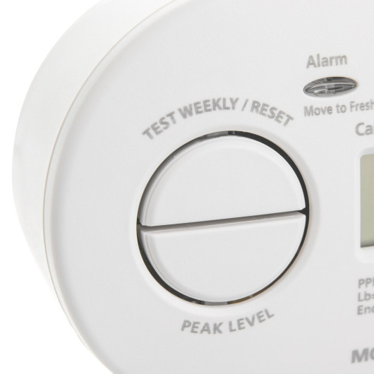Close-up of the test weekly/reset and peak level button on the See the peak CO level recorded at the press of a single button device
