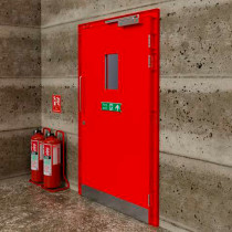 Red tempus temporary fire door shown from the front installed against a concrete wall with fire safety equipment nearby