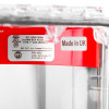 Red sti flush mounted call point cover showing white label with manufacturing and safety information
