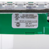 Close-up of label on sti flush mounted call point cover with sounder green showing serial number and certification details