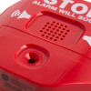 Closeup of the sounder on the fire extinguisher theft stopper showing speaker holes and red plastic casing