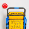 fire extinguisher theft stopper attached to the handle of a blue and yellow evac+chair displayed against a white background